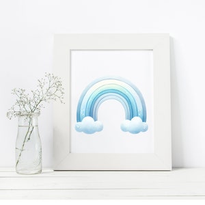 May include: A white frame with a blue watercolor rainbow and clouds print. The rainbow has a light blue, blue, and dark blue color gradient.