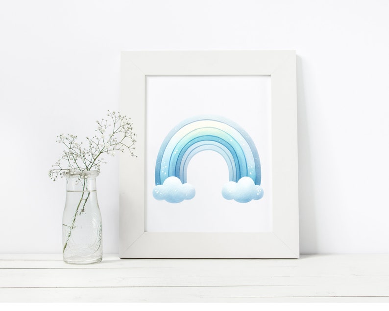 May include: A white frame with a blue watercolor rainbow and clouds print. The rainbow has a light blue, blue, and dark blue color gradient.