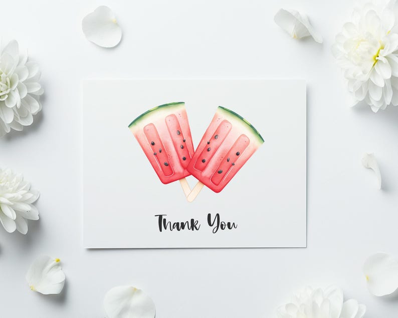 May include: A white card with a watercolor illustration of two watermelon popsicles. The popsicles are red with black seeds and green rinds. The words "Thank You" are written in black script below the popsicles. White flowers and petals surround the card.