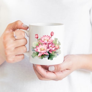 May include: White ceramic mug with a pink and green watercolor illustration of lotus flowers.