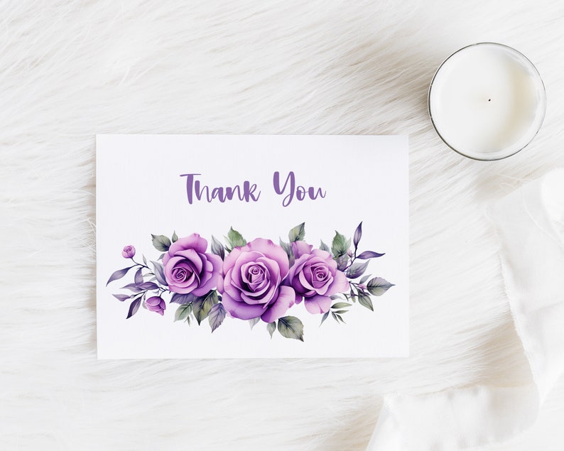 May include: A white card with the text "Thank You" printed in purple. The card is decorated with a cluster of purple watercolor roses and green leaves.
