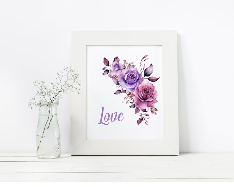 May include: A white frame with a watercolor painting of purple and pink roses with green leaves. The word "Love" is written in purple below the flowers.
