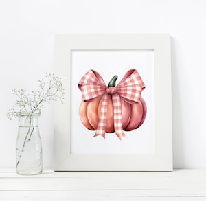 May include: A watercolor illustration of a pink pumpkin with a pink and white gingham bow. The pumpkin is sitting on a white background.