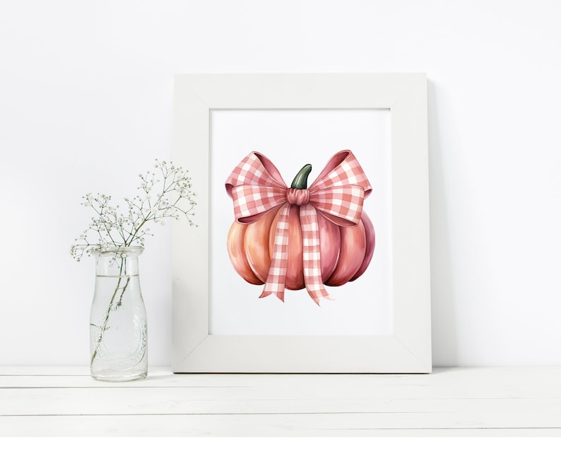 May include: A watercolor illustration of a pink pumpkin with a pink and white gingham bow. The pumpkin is sitting on a white background.