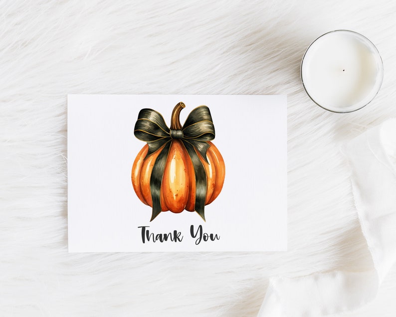 May include: A thank you card with a watercolor illustration of an orange pumpkin with a black bow. The text "Thank You" is printed below the pumpkin.