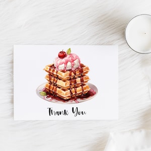 May include: A thank you card with a white background and a drawing of a stack of waffles topped with ice cream and a cherry. The waffles are drizzled with chocolate sauce. The text "Thank You" is printed in black below the waffles.