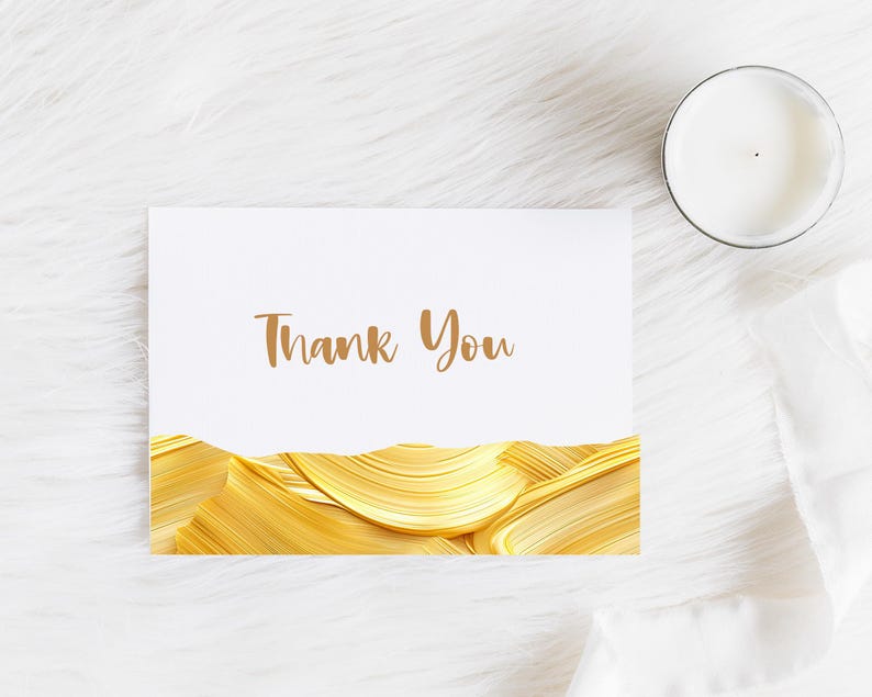 May include: A white card with the words "Thank You" printed in brown text. The card is decorated with a gold abstract design.
