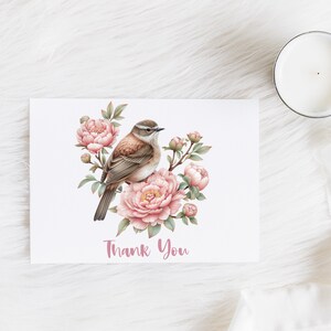 May include: A thank you card with a watercolor illustration of a brown bird perched on a branch with pink peonies. The text "Thank You" is written in pink below the bird.