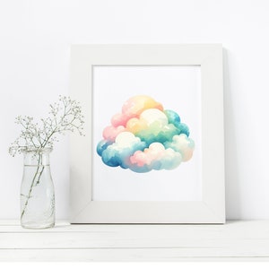 Puede incluir: Una pintura de acuarela de una nube arco&iacute;ris en un marco blanco. La nube est&aacute; compuesta por m&uacute;ltiples formas esponjosas en tonos de rosa, amarillo, azul y verde.