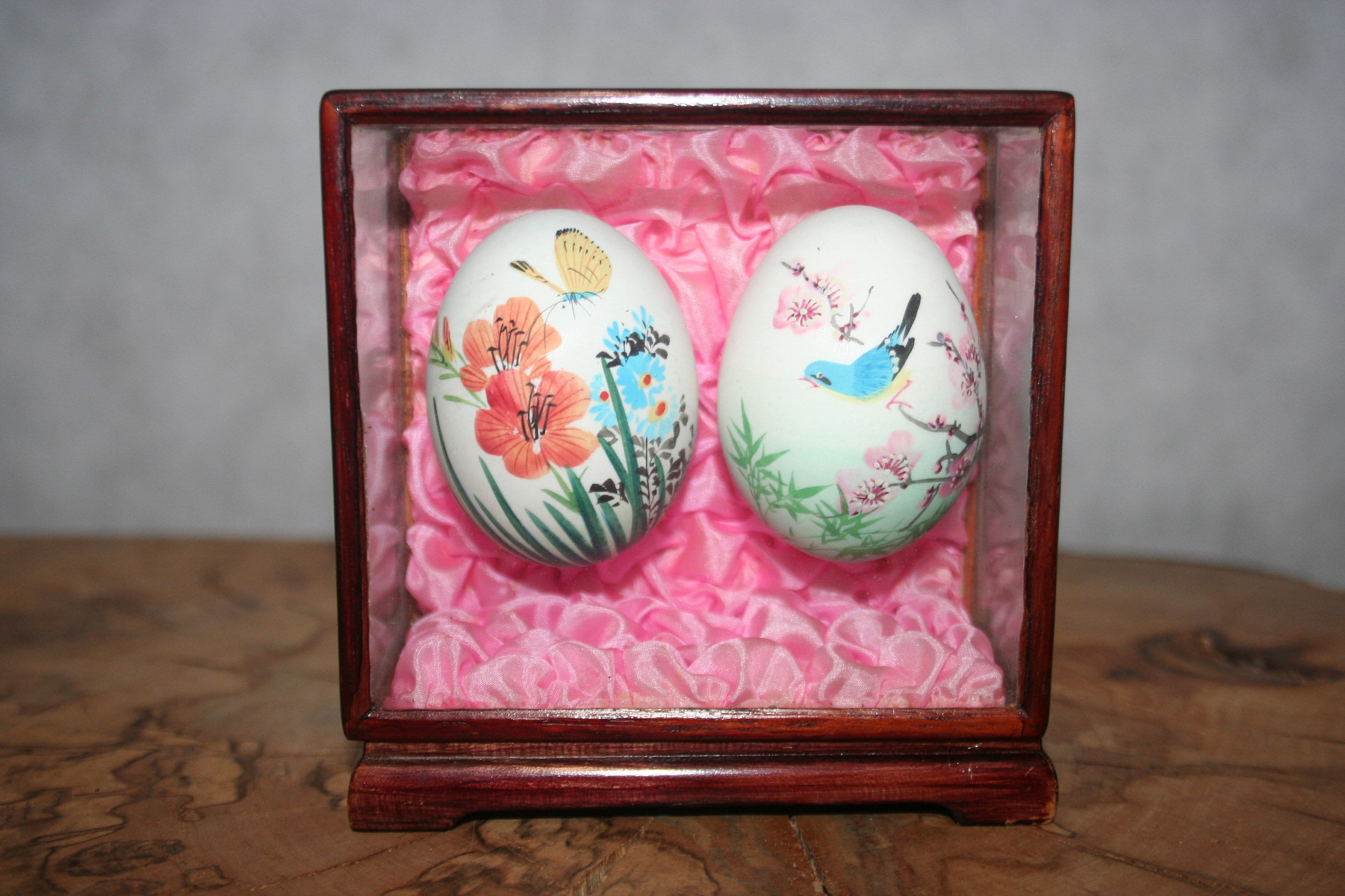 Hand Painted Chinese eggs in glass case