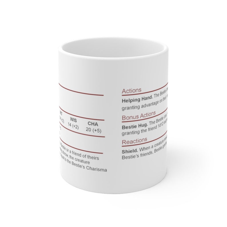 May include: White ceramic mug with brown text describing a character's actions, bonus actions, and reactions. The text includes the words "Helping Hand", "Bestie Hug", and "Shield".