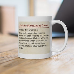 May include: White ceramic mug with a brown border and text that reads "Mug of Boundless Coffee wondrous item, uncommon This ceramic mug radiates a gentle warmth and upon speaking the command word, continuously fills itself with a rich, aromatic coffee. When consumed, this magical brew revitalizes its drinker, removing one level of exhaustion once per day."