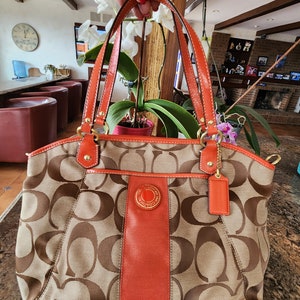 Coach purse with orange hotsell trim