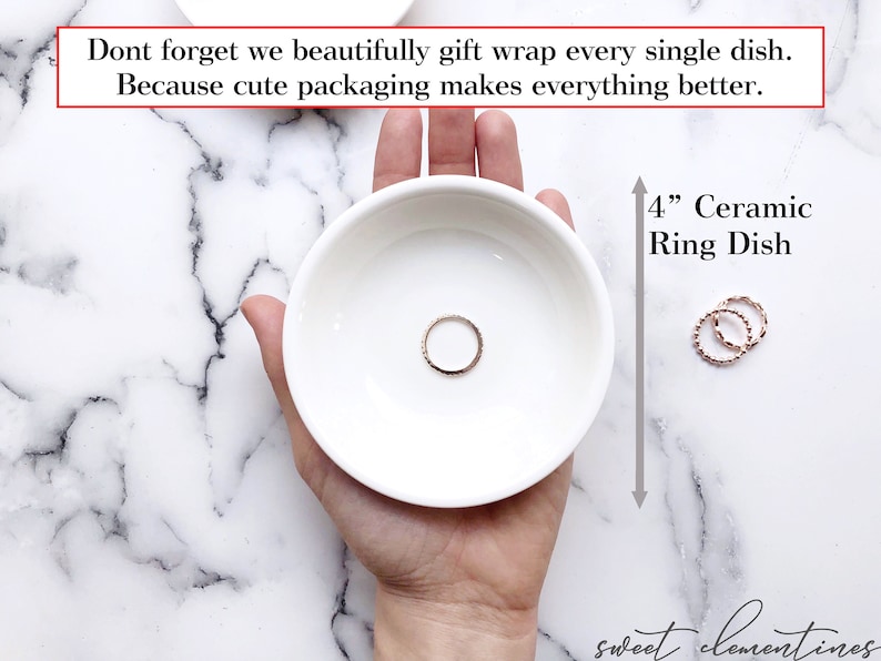 May include: A white ceramic ring dish, 4 inches in diameter, with a gold ring inside. The dish is being held in a hand, and the text "4" Ceramic Ring Dish" is visible in the image.