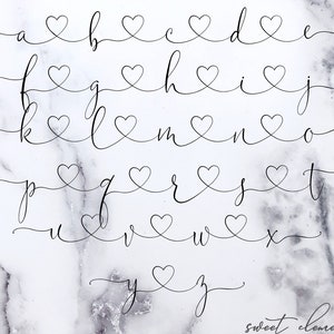 May include: A handwritten alphabet with each letter featuring a heart design. The letters are written in a cursive script style.