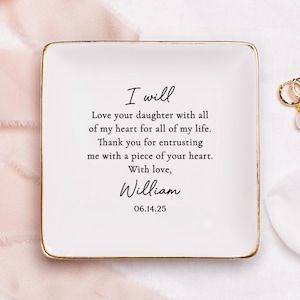 May include: White ceramic trinket dish with a gold rim. The dish has a message that reads "I will Love your daughter with all of my heart for all of my life. Thank you for entrusting me with a piece of your heart. With love, William 06.14.25"