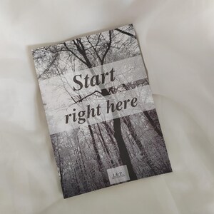 May include: A black and white photograph of a forest with the text "Start right here" and "L.E.P. Motivation" printed at the bottom.