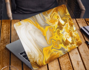 May include: A laptop computer with a yellow and white abstract marble design on the lid. The laptop is open and the keyboard is visible.