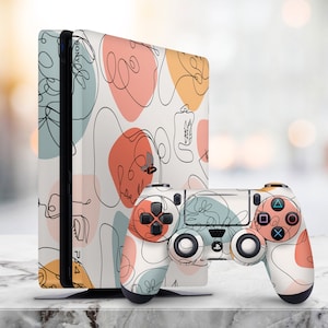 May include: A white and beige PlayStation 4 console and controller with a black and white abstract line art design. The design features swirls and lines in a minimalist style.