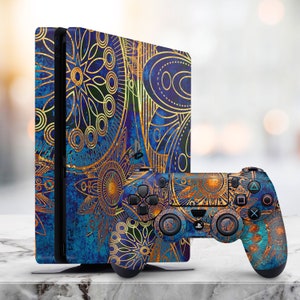 May include: A blue and gold patterned Playstation 4 console and controller. The console has a textured, blue background with gold geometric designs. The controller has the same pattern on the front and back.