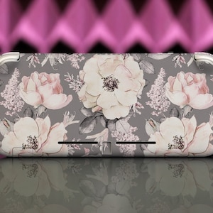 May include: A gray Nintendo Switch case with a floral design featuring pink and white roses and leaves. The case has a silver trim around the edges.