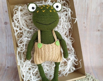 Amigurumi crochet toy frog.Funny green frog. Stuffed Animal Toy.