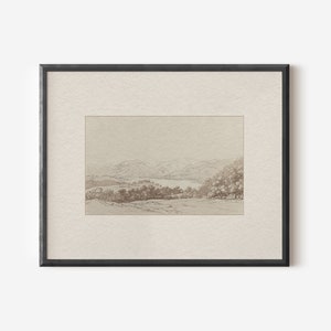 May include: A framed black and white pencil drawing of a landscape with a lake in the distance. The drawing is on a textured paper with a light brown background.