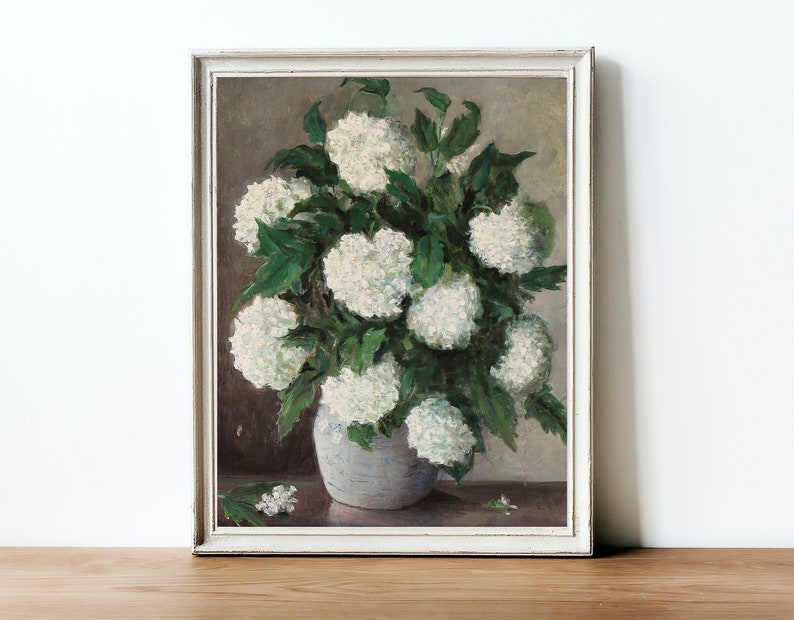 May include: A vintage painting of a white flower bouquet in a white vase. The flowers are arranged in a cluster and have green leaves. The background is a muted brown color.