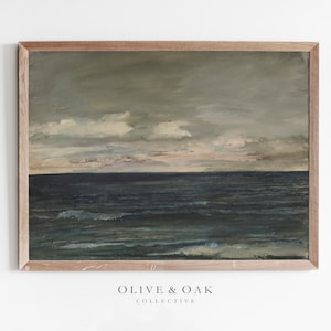 May include: A framed painting of a seascape with a cloudy sky and a dark blue ocean. The painting is in a light wood frame.