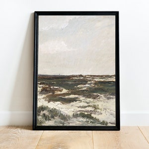 K&ouml;nnte beinhalten: Ein gerahmtes Gem&auml;lde, das eine Landschaft mit einem bew&ouml;lkten Himmel, gr&uuml;nem Gras und wei&szlig;en Sandd&uuml;nen zeigt. Das Gem&auml;lde ist in einem schwarzen Rahmen.