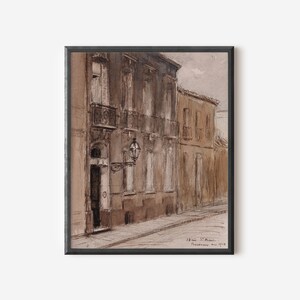 May include: A watercolor painting of a street scene in a European city. The buildings are painted in shades of brown and beige, and the street is empty. The painting is signed "Henri S. Rouvier, Provence, Mai 1918."