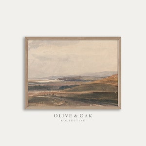 May include: A framed watercolor painting of a landscape with rolling hills and a distant body of water. The sky is a soft blue with wispy clouds. The colors are muted and earthy, with shades of brown, green, and blue.