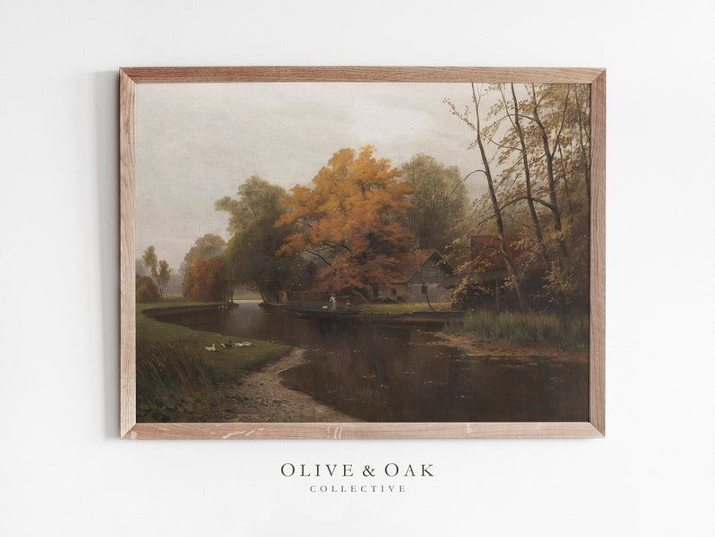 Puede incluir: Una pintura enmarcada que representa una escena de paisaje con un r&iacute;o, &aacute;rboles y una peque&ntilde;a casa. Los &aacute;rboles est&aacute;n en colores oto&ntilde;ales, con tonos de amarillo, naranja y rojo. El r&iacute;o es tranquilo y reflectante, y el cielo est&aacute; nublado.