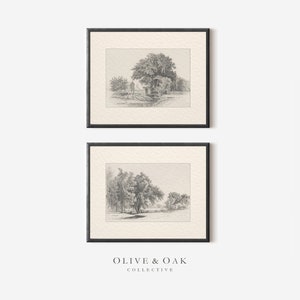 May include: Two black framed prints of pencil drawings of trees and landscapes. The top print shows a group of trees with a small building in the background. The bottom print shows a single tree with a river in the background. The prints are both on a white background.