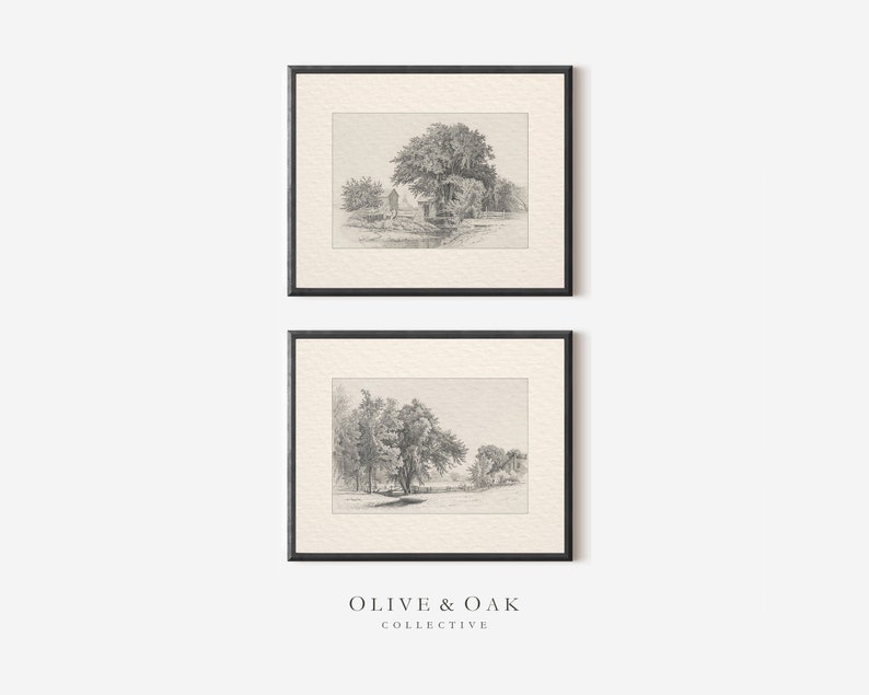 May include: Two black framed prints of pencil drawings of trees and landscapes. The top print shows a group of trees with a small building in the background. The bottom print shows a single tree with a river in the background. The prints are both on a white background.