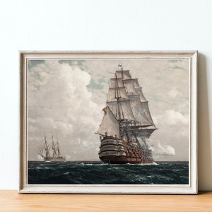May include: A framed painting of a large sailing ship with white sails and a brown hull, sailing on a cloudy day. A smaller ship is visible in the distance.