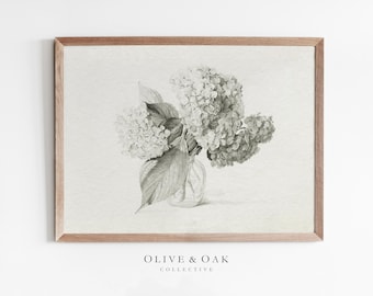 May include: A black and white pencil drawing of a bouquet of hydrangeas in a clear glass vase. The hydrangeas are arranged in a loose, natural style. The drawing is framed in a light wood frame.