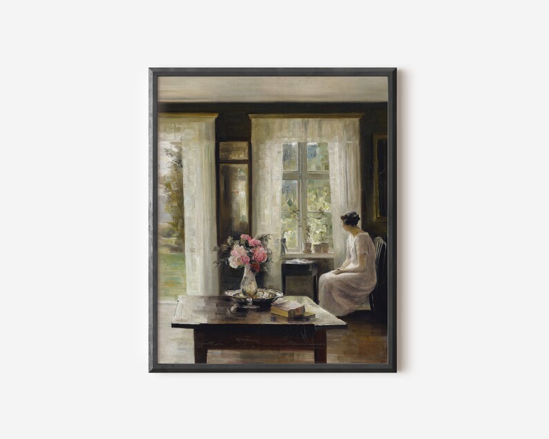 May include: A painting of a woman sitting by a window in a room with white curtains. The woman is wearing a white dress and is looking out the window. There is a vase of pink flowers on a table in front of her.