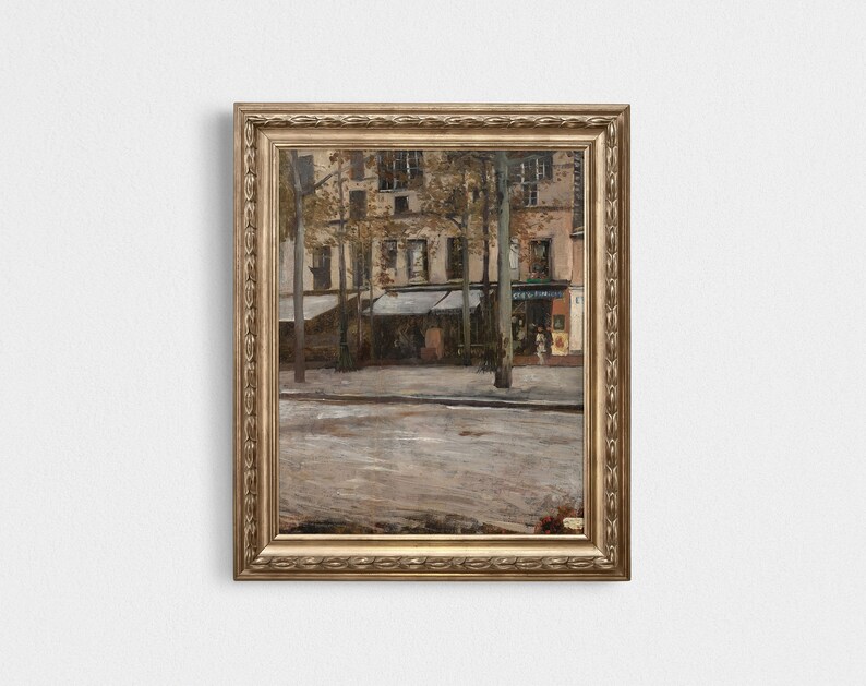 May include: A framed painting depicting a street scene in Paris, France. The painting features a street lined with buildings and trees, with a cafe on the right side of the image. The cafe has a sign that reads "Cafe du Commerce".
