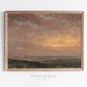 Pode incluir: Uma pintura emoldurada de uma paisagem com um céu de pôr do sol. O céu é uma mistura de rosa, laranja e amarelo, com nuvens. A paisagem é de um verde escuro, com colinas ao longe.