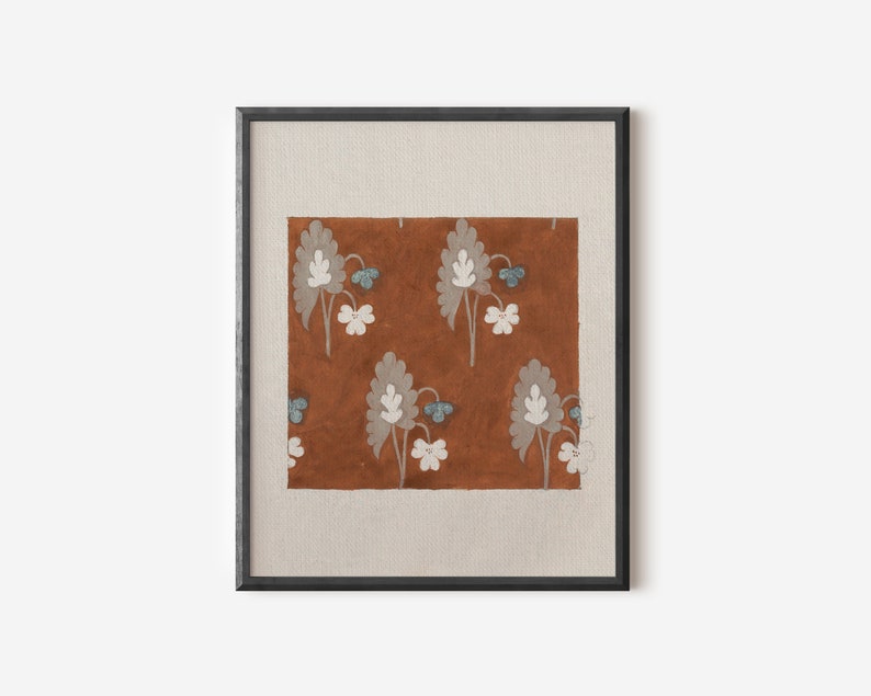 May include: A framed print of a floral pattern on a brown background. The flowers are white with blue centers and are arranged in a repeating pattern.