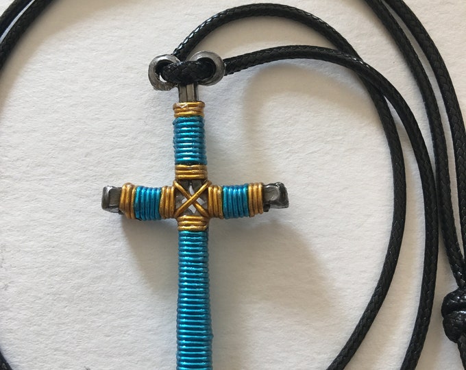 Hand made "Cross Your Heart"  design horseshoe nail cross pendant