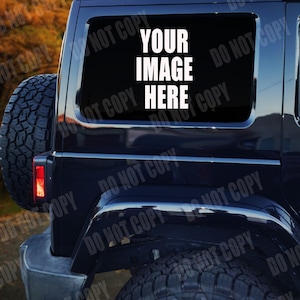 May include: A black Jeep with a rear window sticker that says "YOUR IMAGE HERE".