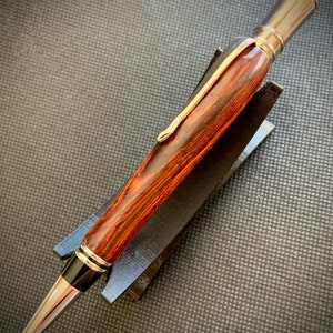 Custom one-off hand-turned pen made from gorgeous Cocobolo wood. Hardware is plated with Rhodium.