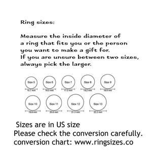 May include: A chart showing ring sizes in US sizes with corresponding inside diameter measurements in millimeters. The chart includes sizes 5 through 13. The text reads "Ring sizes: Measure the inside diameter of a ring that fits you or the person you want to make a gift for. If you are unsure between two sizes, always pick the larger. Sizes are in US size. Please check the conversion carefully. conversion chart: www.ringsizes.co"