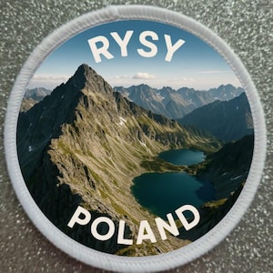 May include: Round patch featuring a mountain landscape with two lakes. The text "RYSY" is arched across the top, and "POLAND" is arched across the bottom in white letters. The patch has a white border.