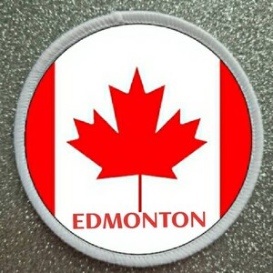 May include: White and red Canadian flag patch with a red maple leaf and the word "EDMONTON" in black text.