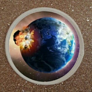 May include: A round patch with a white border and a colorful image of a fiery asteroid hitting the Earth. The Earth is blue and green with a purple glow around it.