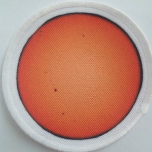 The Sun 3 inch iron or sew on Patch Badge