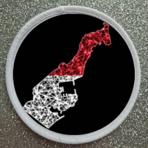 May include: Round patch featuring a map outline of Monaco in red and white, set against a black background. The map is a network design, with a white border. The patch is likely for clothing or accessories.